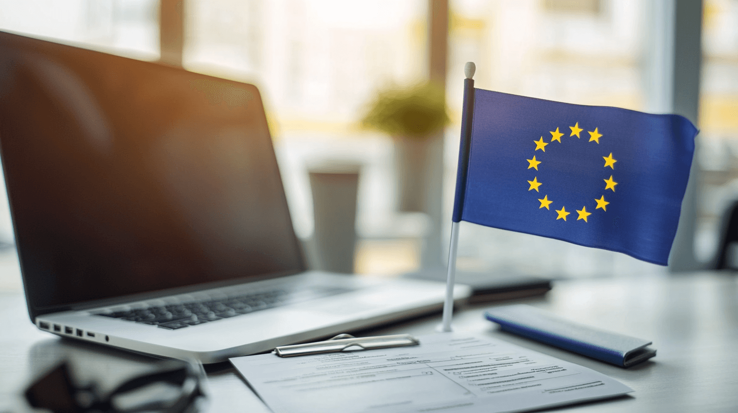 Bandeira da União Europeia ao lado de laptop mostrando formulário de autorização de viagem